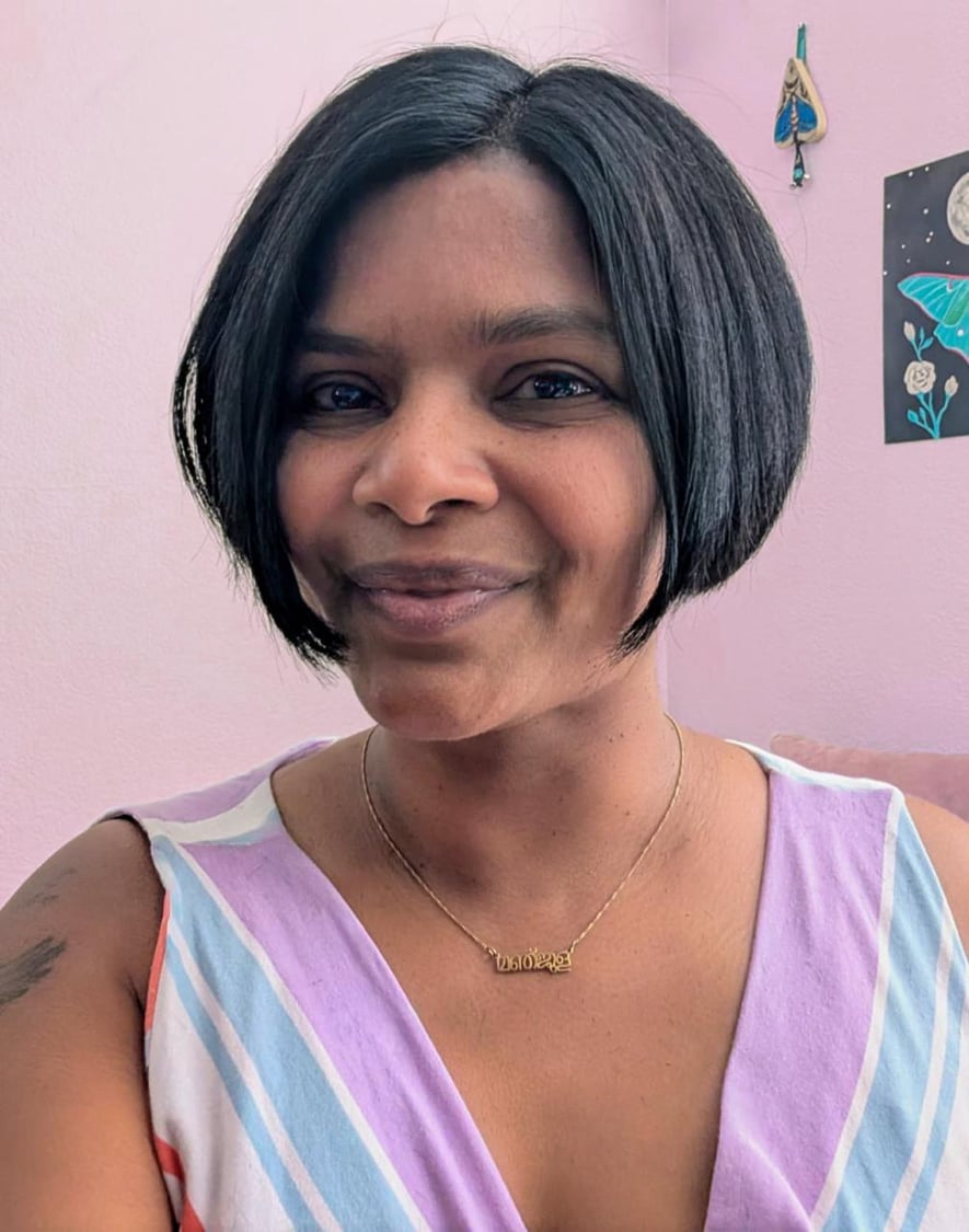 Portrait of Manjula smiling outdoors